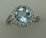 10 Karat White Gold Diamond Ring With Round Blue Topaz Stone