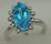 10 Karat White Gold Diamond Ring With Oval Blue Topaz Stone