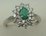 10 Karat White Gold Diamond Ring With Flower Shaped Emerald Stone 