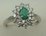 10 Karat White Gold Diamond Ring With Flower Shaped Emerald Stone