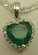 10 Karat White Gold Diamond Pendant with Heart Shaped Emerald stone