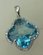 10 Karat White Gold Diamond Pendant with Flower Shaped Blue Topaz Stone