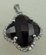 10 Karat White Gold Diamond Pendant with Flower Shaped Garnet Stone