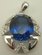 Sterling Silver Cubic Zirconia Oval Shaped Pendant with Synthetic Sapphire