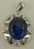 Sterling Silver Cubic Zirconia Oval Shaped Pendant with Synthetic Sapphire