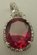 Sterling Silver Cubic Zirconia Pendant with Oval Shaped Synthetic Ruby