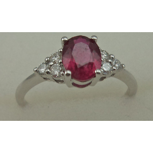 10 Karat White Gold 4 Claw Diamond Ring With Oval Shaped Ruby Stone
