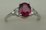 10 Karat White Gold 4 Claw Diamond Ring With Oval Shaped Ruby Stone
