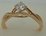 9 Karat Yellow Gold with 0.21 Carat Diamond Twisted and Cross Over Solitaire Ring 