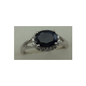 10 Karat White Gold 4 Claw Diamond Ring With Oval Shaped Sapphire Stone