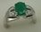 10 Karat White Gold Diamond Shoulder Ring with Oval Shaped Emerald