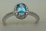 10 Karat White Gold Daimond Ring With Blue Topaz Stone